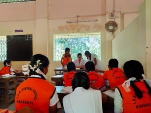 A class in session, students in the orange PT uniform.