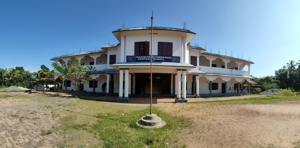 The school building at Thevarnada, Kadakkal, with its name board and flagstaff.